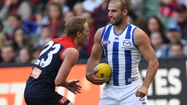 Ben Cunnington collects Bernie Vince with a punch to the stomach.