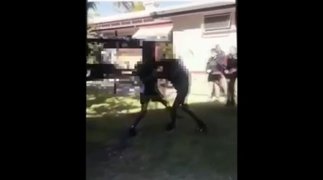 Students watch on as two females brawl at North Rockhampton State High