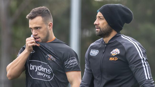 Departing Tigers halfback Luke Brooks (L) admits he doesn’t know who is actually calling the shots at Wests. Picture: AAP.