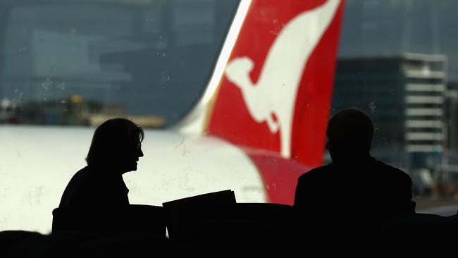 SYDNEY, AUSTRALIA - JUNE 21: Passangers wait at a Qantas departure gate as airlines cancel flights due to volcanic ash at Sydney Domestic Airport on June 21, 2011 in Sydney, Australia. Air travel across the country is being disrupted again, as a result of volcanic ash cloud from Chile inundating Australian air space. Sydney, Adelaide, Canberra and Melbourne airports have been affected, with all major airlines announcing cancellations. It is expected Brisbane airport will next be affected as the cloud travels over the east of the country. (Photo by Ryan Pierse/Getty Images)