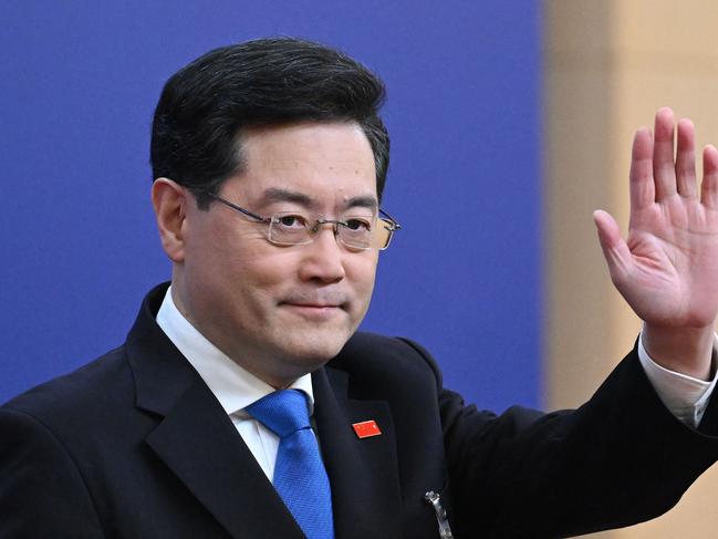 (FILES) China's Foreign Minister Qin Gang waves as he arrives for a press conference at the Media Center of the National People's Congress (NPC) in Beijing on March 7, 2023. China's foreign minister Qin Gang was removed from office on July 25, 2023, state media reported, after not being seen in the public eye for a month. (Photo by NOEL CELIS / AFP)