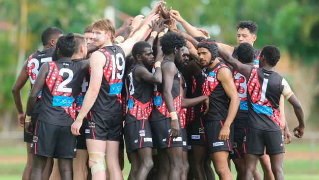 Cyril Rioli joins his Tiwi Bombers teammates before the first bounce. Picture: Glenn Campbell