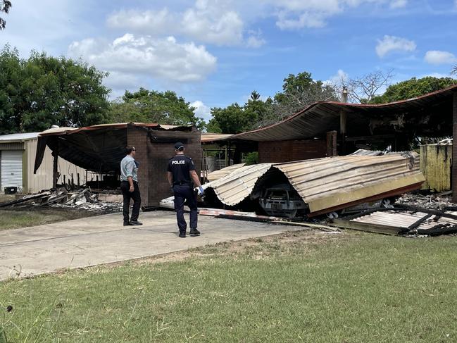 Detectives and scenes of crime officers on scene at a Nebo home where a home and cars were gutted by a fire. Picture: Janessa Ekert