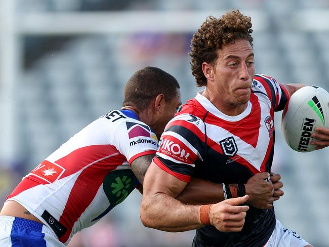 GOSFORD, AUSTRALIA - FEBRUARY 23: Mark Nawaqanitawase of the Roosters is tackled during the 2025 NRL Pre-Season Challenge match between Sydney Roosters and Newcastle Knights at Industree Group Stadium on February 23, 2025 in Gosford, Australia. (Photo by Mark Metcalfe/Getty Images)