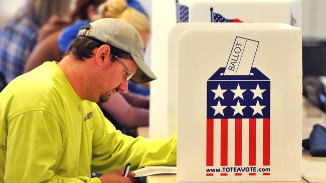 An Iowa man votes in the US elections in November.