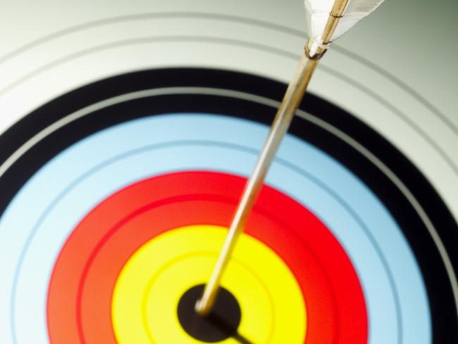 Close-up of arrow in bulls eye of target. Archery. Bullseye. Generic image.