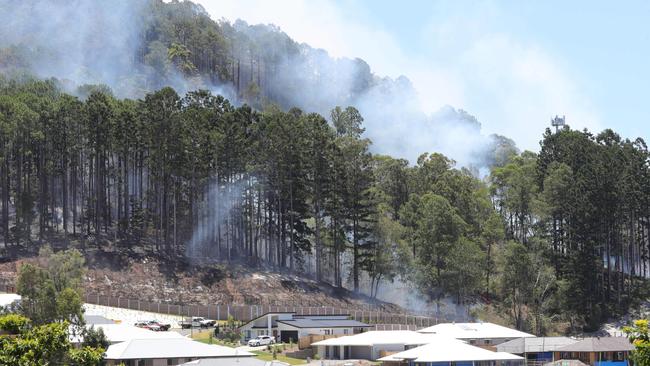 Smoke from the bushfire seen near homes at Maudsland. Picture: Glenn Hampson