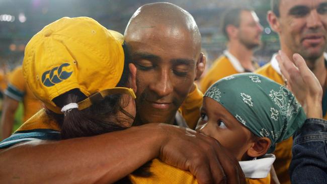 George Gregan hugs his wife Erica and son Max after the 2003 Rugby World Cup Final. Picture: Adam Pretty/Getty Images