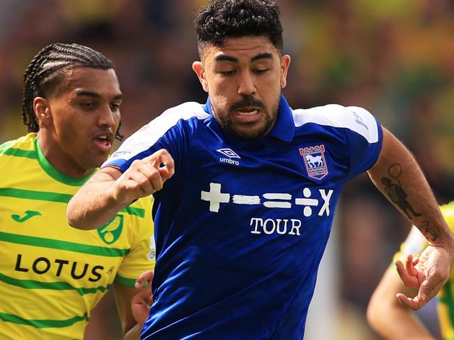 NORWICH, ENGLAND - APRIL 06: Massimo Luongo of Ipswich Town runs with the ball under pressure from Sam McCallum of Norwich City during the Sky Bet Championship match between Norwich City and Ipswich Town at Carrow Road on April 06, 2024 in Norwich, England. (Photo by Stephen Pond/Getty Images) (Photo by Stephen Pond/Getty Images)