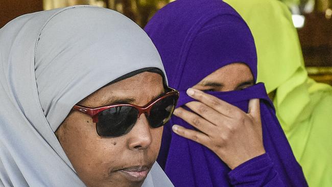 Ms Abdirahman-Khalif, in purple, leaves court following her acquittal. Picture: AAP/Roy Vandervegt.