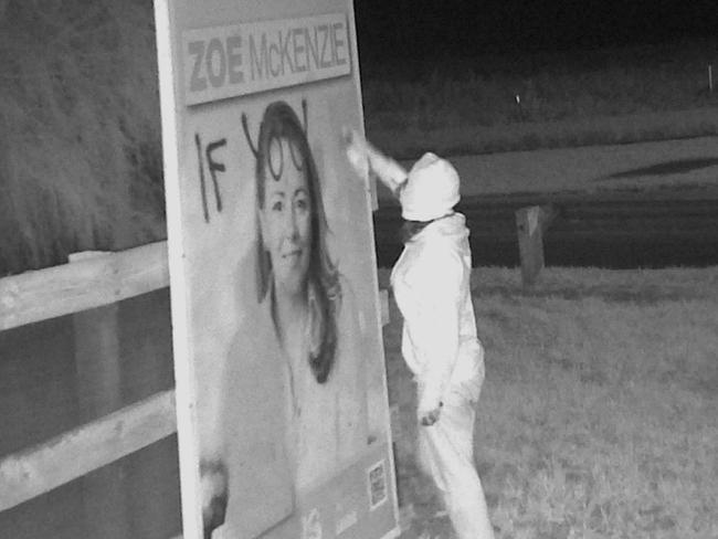 A GRAFFITI culprit has been caught on camera defacing the election signs of Liberal candidate Zoe McKenzie with vile slogans. Supplied