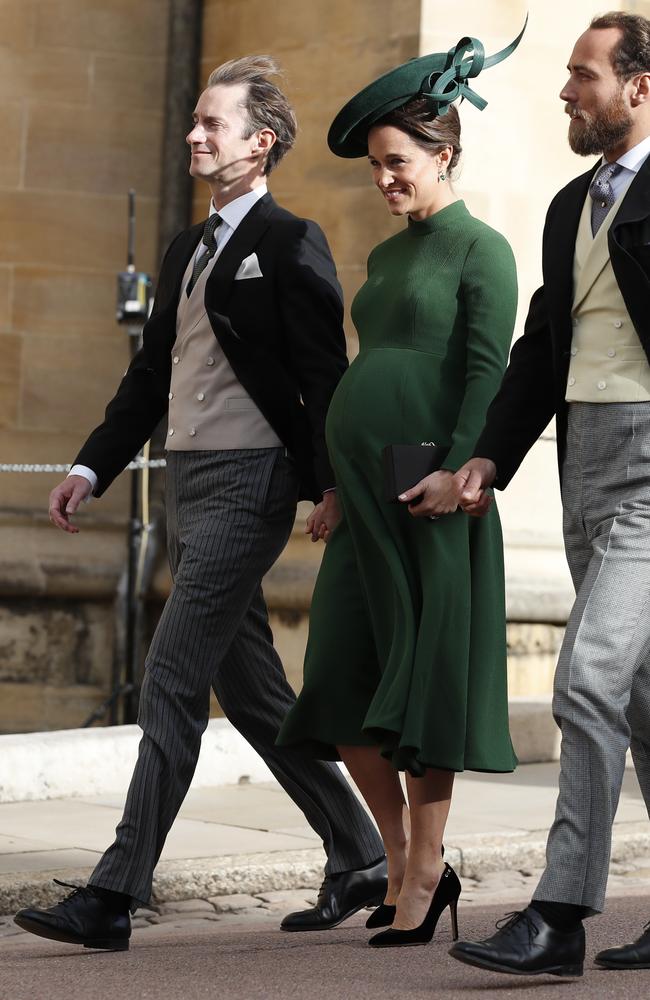Pippa Middleton, center, arrives with her husband James Matthews, left, and her brother James Middleton for the wedding of Princess Eugenie of York and Jack Brooksbank at St George's Chapel, Windsor Castle, near London, England, Friday, Oct. 12, 2018. (AP Photo/Alastair Grant, Pool)