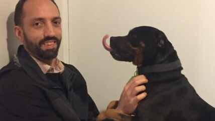 Daniel Witteveen from Canberra didn’t want the full-time responsibility of a pet so he gets his dog cuddles from casual pet sitting instead. Picture: Supplied