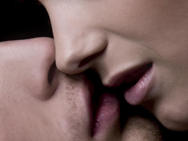 Portrait of a hot young couple kissing