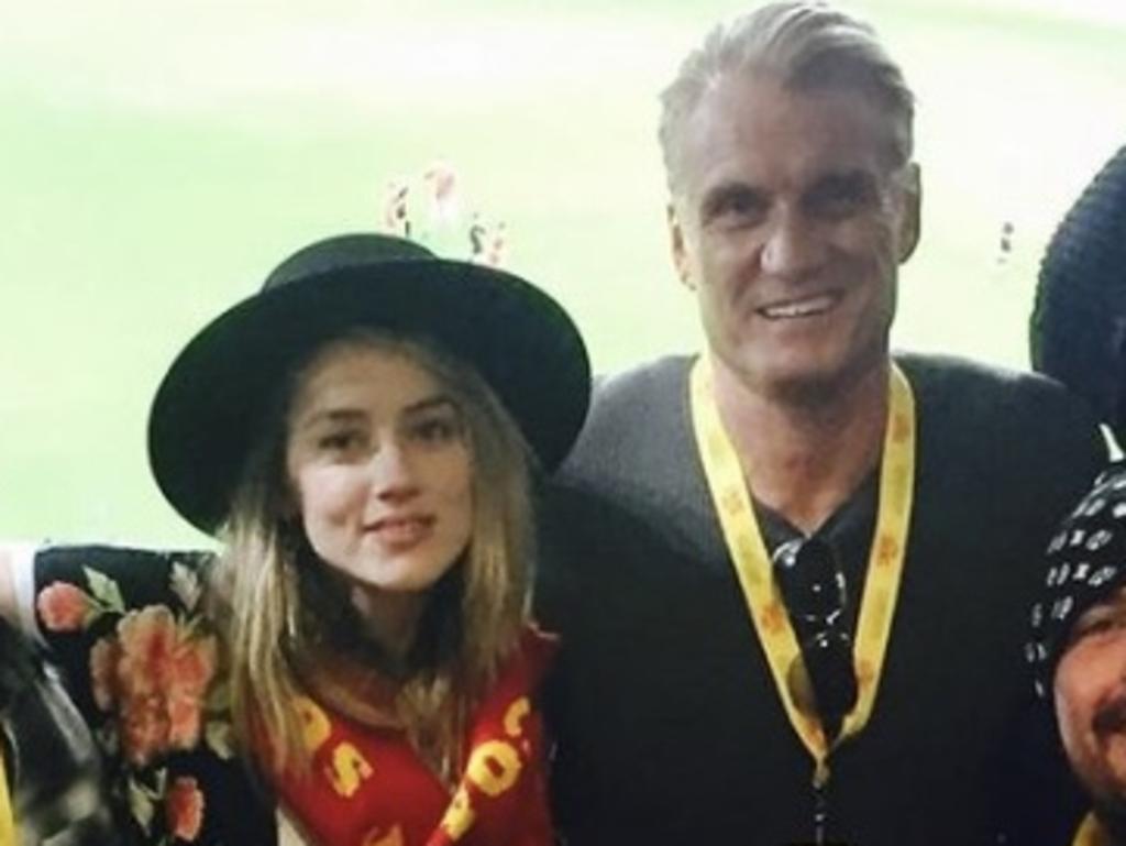 Amber Heard with co-star Dolph Lundgren, pictured in 2017 on the Gold Coast during filming of the original Aquaman. Picture: Instagram