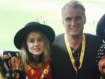 Amber Heard with co-star Dolph Lundgren, pictured in 2017 on the Gold Coast during filming of the original Aquaman. Picture: Instagram