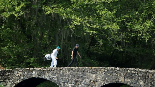 Calm before the storm... England’s Matt Wallace walks across the Nelson bridge on the 13th hole during a practice round prior to The Masters at Augusta National Golf Club on April 08, 2019 in Augusta, Georgia. (Photo by Andrew Redington/Getty Images)