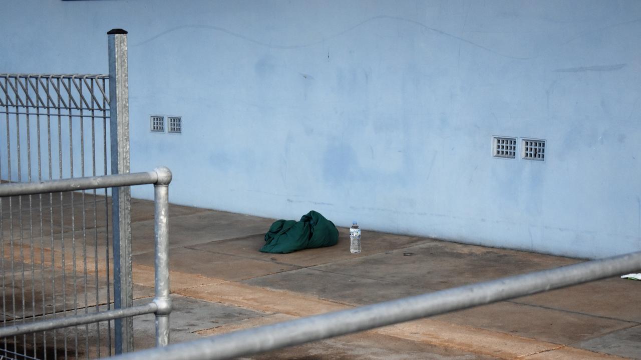 A water bottle and an item of clothing on the McIlwraith Street footpath near the intersection with Davidson Street on Monday morning following the fatal stabbing of a 20-year-old man in Ingham late on Sunday night. Photograph: Cameron Bates