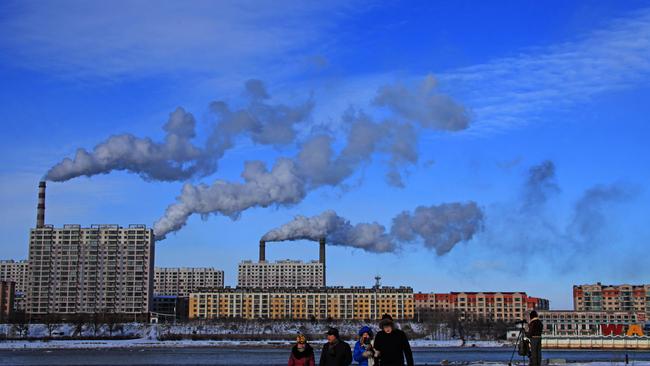 --FILE--Smoke is discharged from chimneys at a coal-fired power plant in Jilin city, northeast Chinas Jilin province, 14 December 2013.  China, the worlds biggest emitter of greenhouse gases, is considering plans to set an absolute cap on its carbon dioxide emissions from 2016, a top government adviser said. The target will be written into Chinas next five-year plan, which comes into force in 2016, He Jiankun, the chairman of Chinas Advisory Committee on Climate Change, told a conference in Beijing. The government will use two ways to control carbon dioxide emissions in the next five-year plan, by intensity and an absolute cap, said He, a former vice-president at Tsinghua University. This is the first time that a senior government adviser has publicly spoken about a timetable for Chinas carbon cap, but He later tried to play down the significance of his statement.