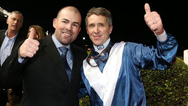 Trainer Lloyd Kennewell and jockey Joe Bowditch celebrate the big win. Picture: AAP.