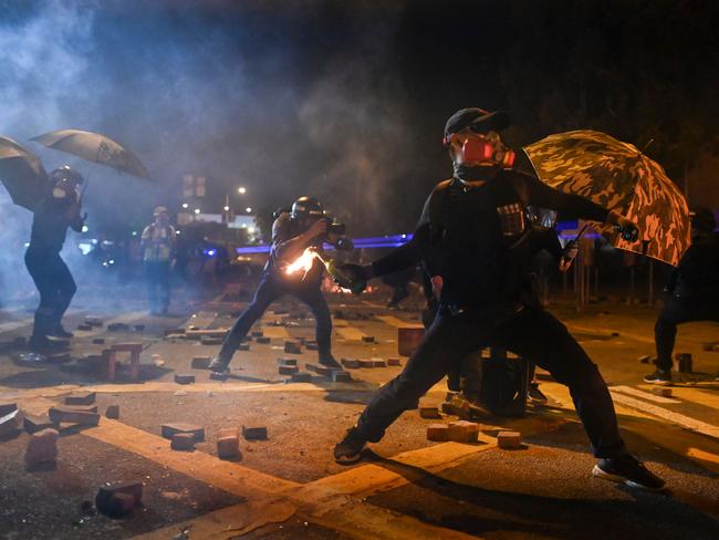 A protester throws a petrol bomb. Picture: AFP