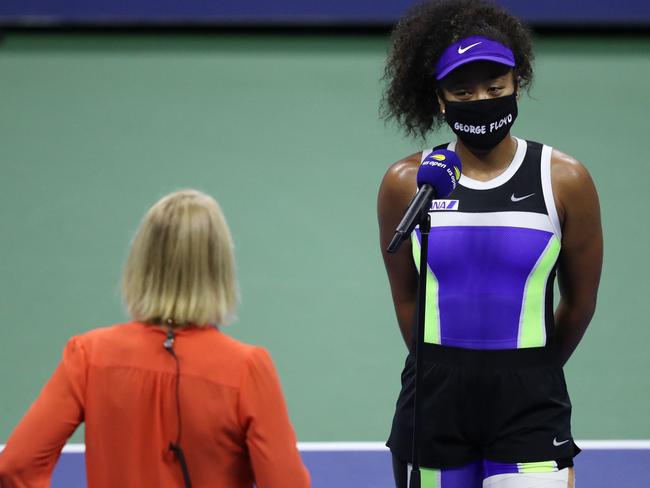 NEW YORK, NEW YORK - SEPTEMBER 08: Naomi Osaka of Japan wears a mask with the name of George Floyd on during an interview following her WomenÃ¢â¬â¢s Singles quarter-finals match win against Shelby Rogers of the United Stateson Day Nine of the 2020 US Open at the USTA Billie Jean King National Tennis Center on September 8, 2020 in the Queens borough of New York City.   Matthew Stockman/Getty Images /AFP == FOR NEWSPAPERS, INTERNET, TELCOS & TELEVISION USE ONLY ==