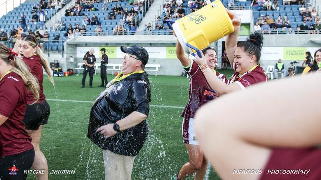 Kawana women's head coach Geoff Wheeler is showered with water after the 2023 grand final. Picture: Richo Jarman