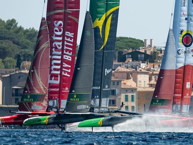 Emirates Great Britain SailGP Team helmed by Ben Ainslie, Australia SailGP Team helmed by Tom Slingsby and Spain SailGP Team helmed by Diego Botin sail past the bell tower and old town of Saint-Tropez on Race Day 2 of the France Sail Grand Prix in Saint-Tropez, France. 10th September 2023. Photo: Ricardo Pinto for SailGP. Handout image supplied by SailGP