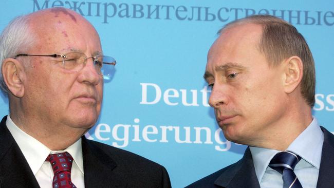 Russian President Vladimir Putin, right, talks to former Soviet president Mikhail Gorbachev prior to a joint press conference of German chancellor Gerhard Schroeder and Mr Putin in 2004. Picture; AFP