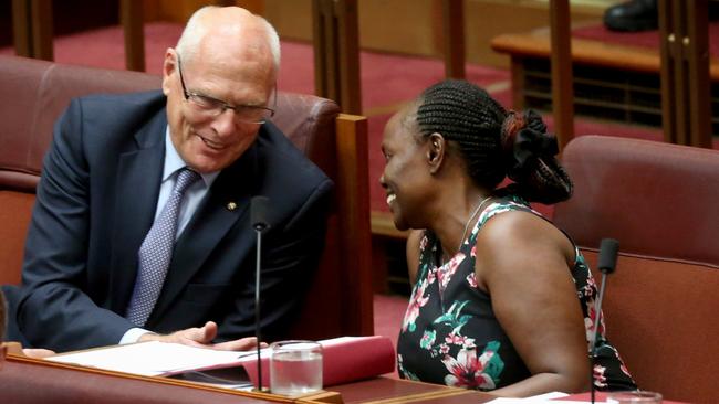 Senator Jim Molan talks to Senator Lucy Gichuhi during Question Time in Senate Chamber.