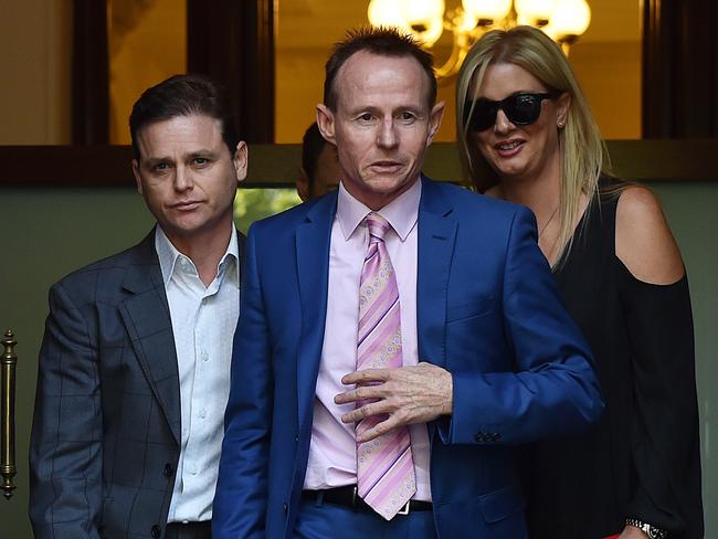 Pat Lennon (centre, pink tie) with Danny Nikolic (left) leaving the Supreme Court at an earlier date. Picture: Ellen Smith