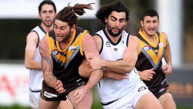 Daniel Chadwick and Xavier Dimasi battle for the ball. Picture: Andy Brownbill