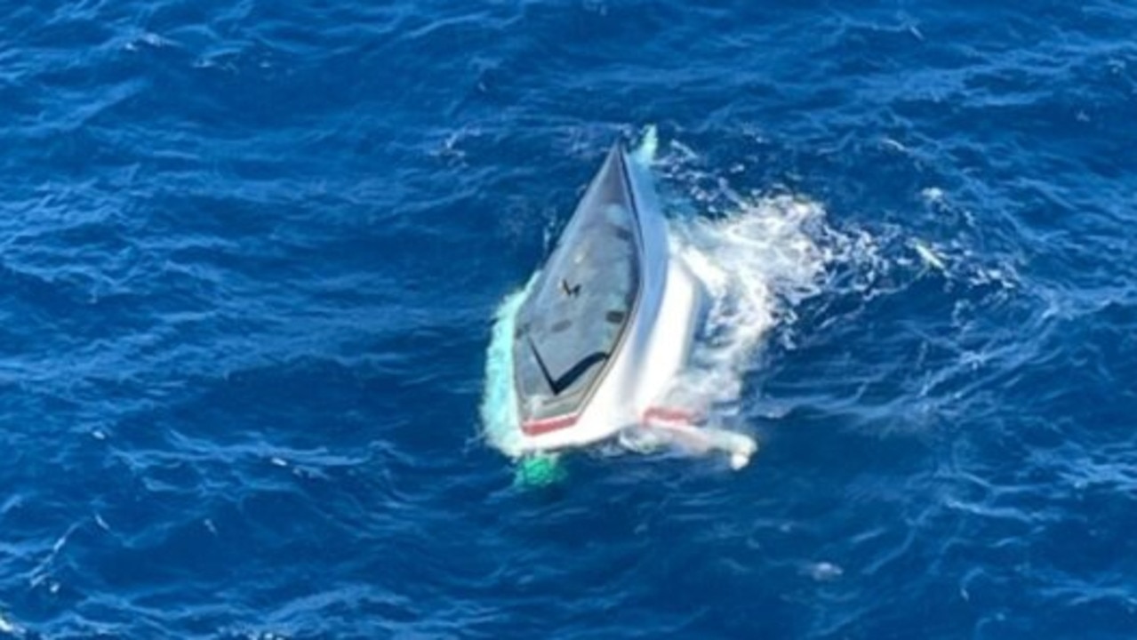 Moment father and son rescued from yacht