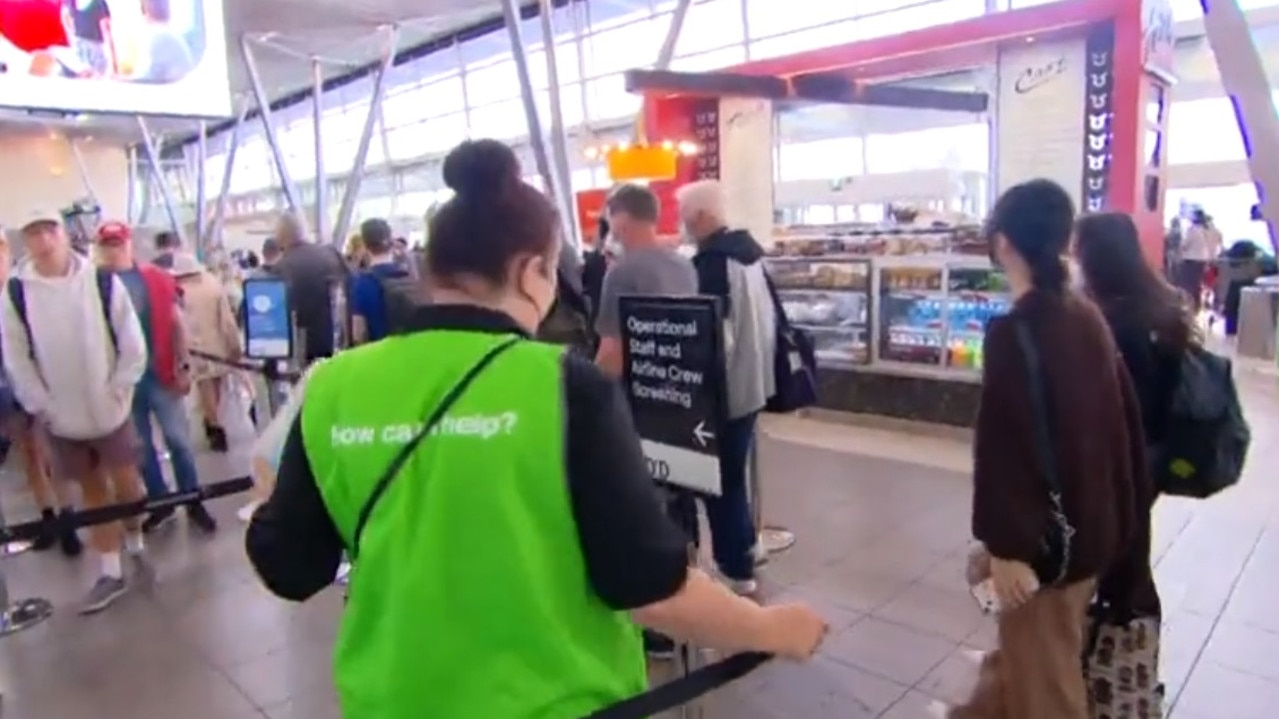 More staff wearing green vests have been hired at Sydney Airport to help passengers. Picture: Nine News