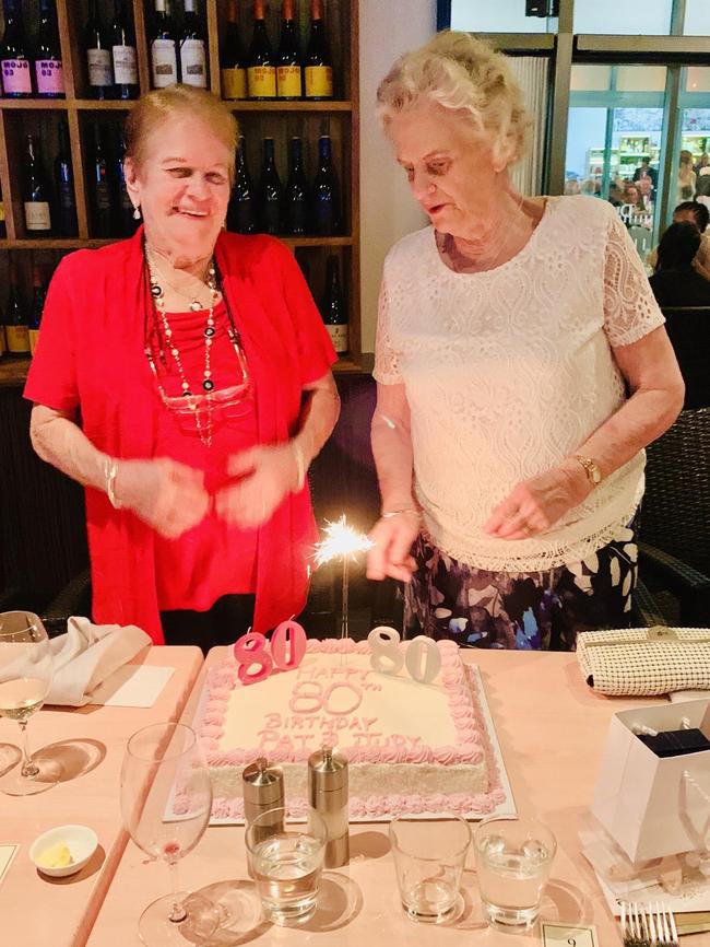 Best part of the night? Cutting the cake! Pat Wilson and Judy Taylor celebrate their 80th birthday in style.