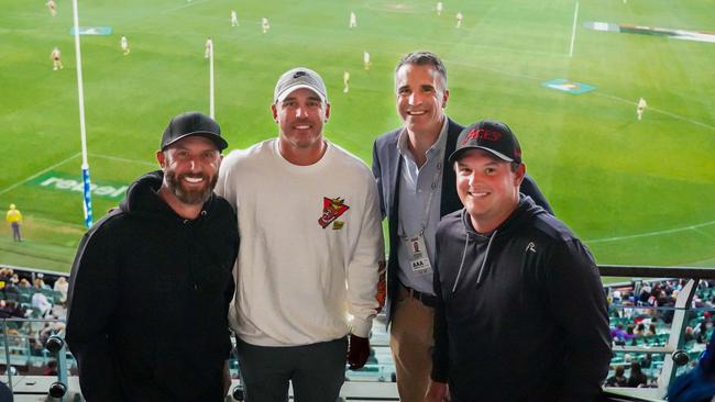 American golfers Dustin Johnson, left, Brooks Koepka  and Patrick Reed with Premier Peter Malinauskas  watching St Kilda v Collingwood match at Adelaide Oval Sunday 16 April, 2023. Picture: Supplied