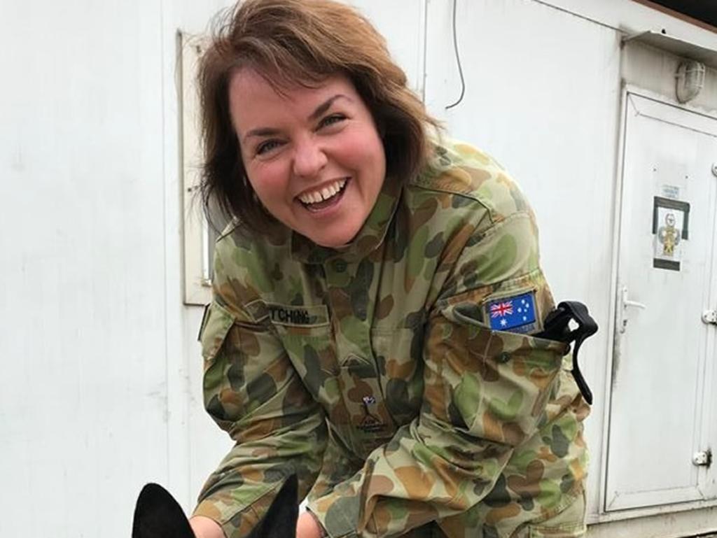 Senator Kimberley Kitching with Attila the dog while visiting Defence personnel in Afghanistan. picture: supplied