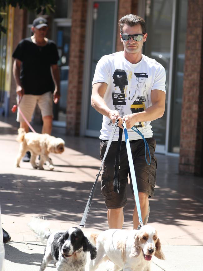 Anthony Koletti picks up his dogs from Woof Dog and Cat Grooming, Rose Bay. Picture: John Grainger