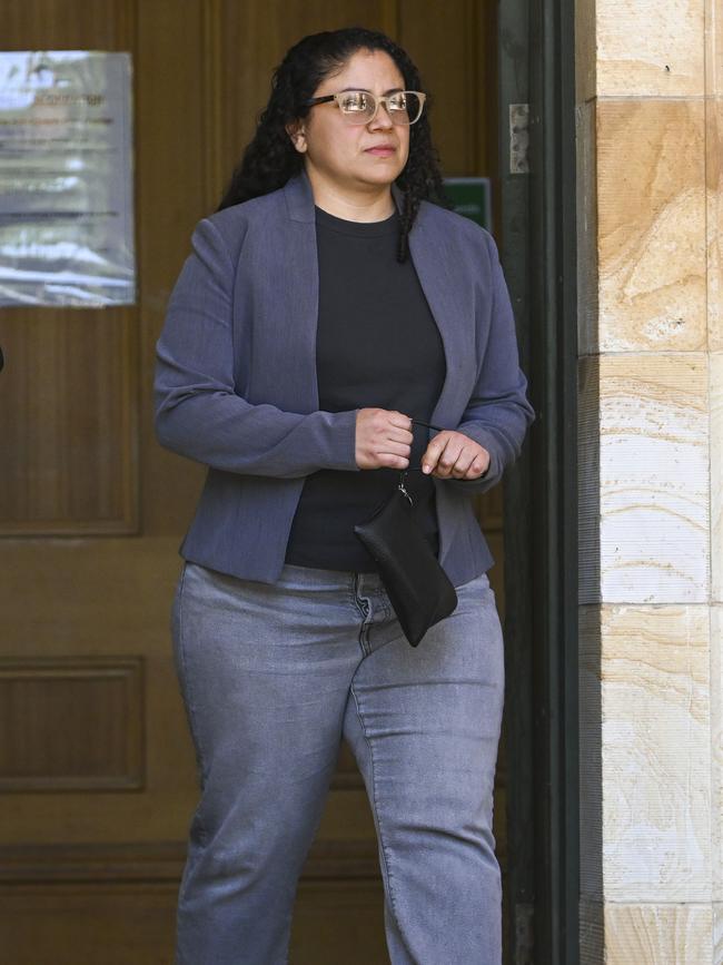 The woman charged with causing a person to enter into debt bondage and remain in servitude leaves the Magistrates Court, Adelaide. Picture Mark Brake