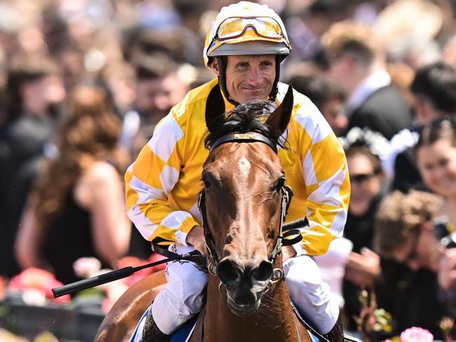 Damien Oliver returns to the mounting yard on Queen Of The Ball after winning the Furphy Sprint, at Flemington Racecourse on November 04, 2023 in Flemington, Australia. (Morgan Hancock/Racing Photos via Getty Images)