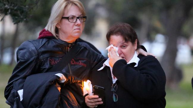 A distraught woman at the candlelight vigil for homeless man Peter Hofmann. Picture: El Earl Photography.