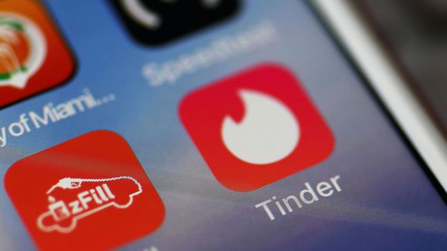 (FILES) In this file photo illustration taken on August 14, 2018, the icon for the dating app Tinder is seen on the screen of an iPhone in Miami, Florida. - Americans' use of online apps and dating websites to meet potential partners is growing even if many people express concerns about participating in these services, a survey showed on February 6, 2020. The Pew Research Center report showed 31 percent of US adults have used an app or dating service. The figure is close to half among adults under 30 years old and people who identify as gay, lesbian or bisexual. (Photo by JOE RAEDLE / GETTY IMAGES NORTH AMERICA / AFP)