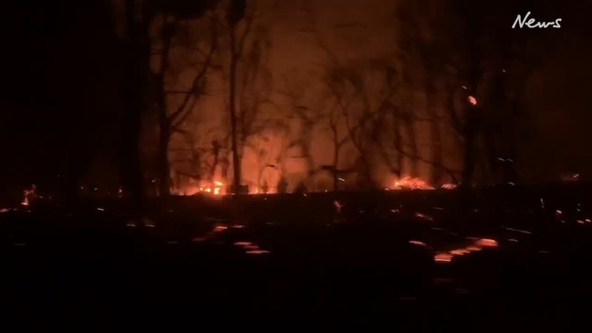 Couple watches bushfire burn down their home