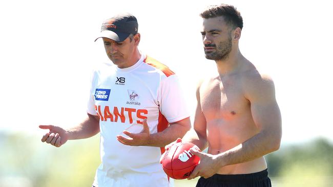 Coniglio, with coach Leon Cameron, tried to prove his fitness for the grand final before ruling himself out. Pic: Phil Hillyard