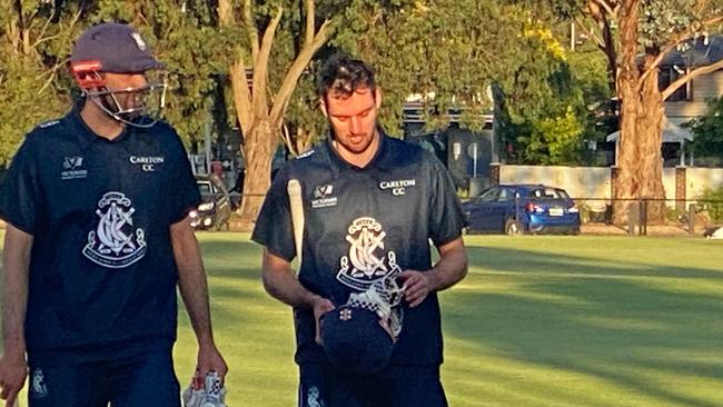 Tom and Harry Smyth walk off after taking Carlton over the line.