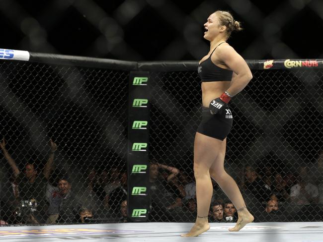 Ronda Rousey celebrates after defeating Alexis Davis in 16 seconds in their women's mixed martial arts bantamweight title bout at UFC 175 earlier this month.