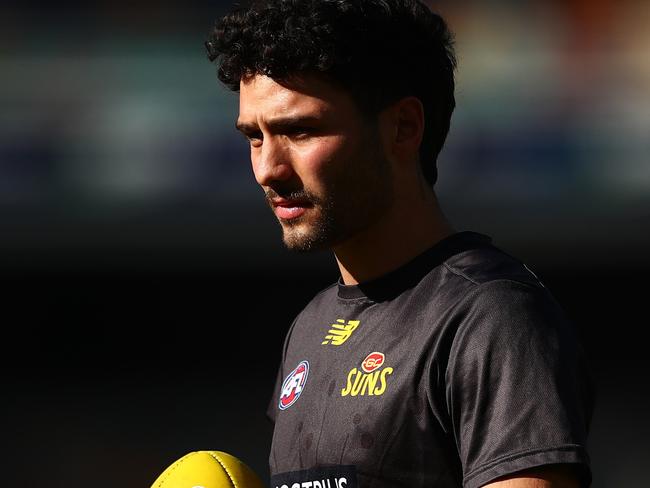 BRISBANE, AUSTRALIA - JULY 24: Izak Rankine warms up during the round 20 AFL match between Brisbane Lions and Gold Coast Suns at The Gabba on July 24, 2021 in Brisbane, Australia.  (Photo by Chris Hyde/AFL Photos/via Getty Images )