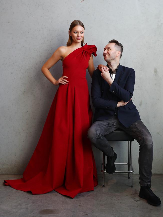 Toni Maticevski with model Tiahnee Skrijel wearing one of his designs at his studio in Yarraville. Picture: The Australian