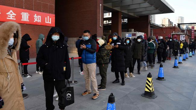 People line up to be tested for the COVID-19 outside a hospital in Beijing. Picture: AFP