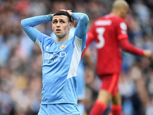 MANCHESTER, ENGLAND - APRIL 10: Phil Foden of Manchester City looks dejected after Riyad Mahrez (not pictured) misses a chance during the Premier League match between Manchester City and Liverpool at Etihad Stadium on April 10, 2022 in Manchester, England. (Photo by Michael Regan/Getty Images) *** BESTPIX ***